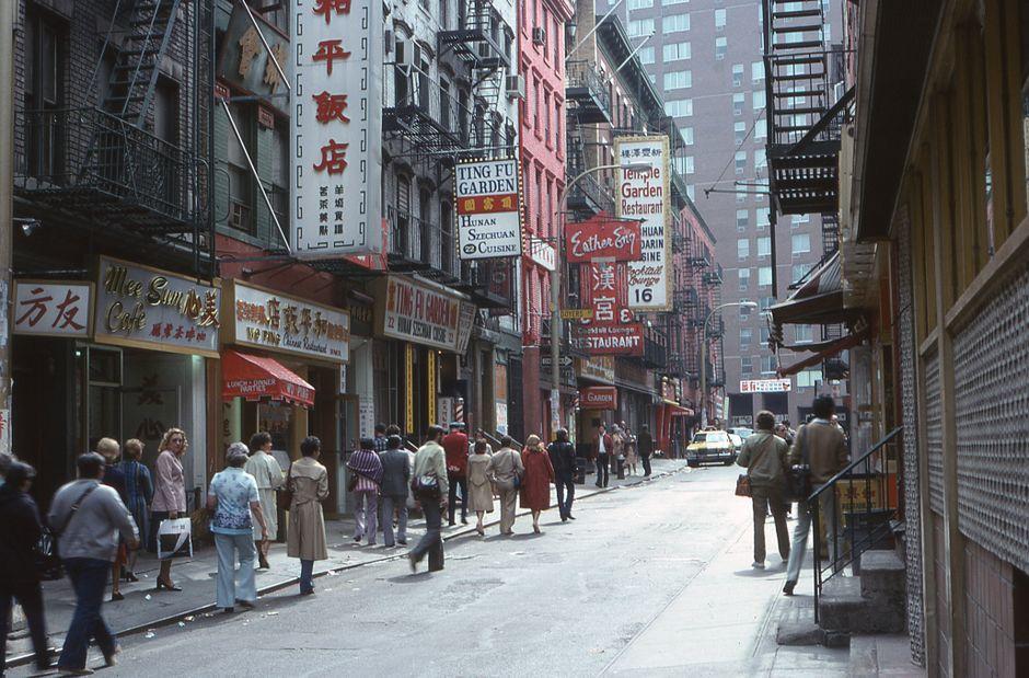 A People Walking on a Sidewalk in a City